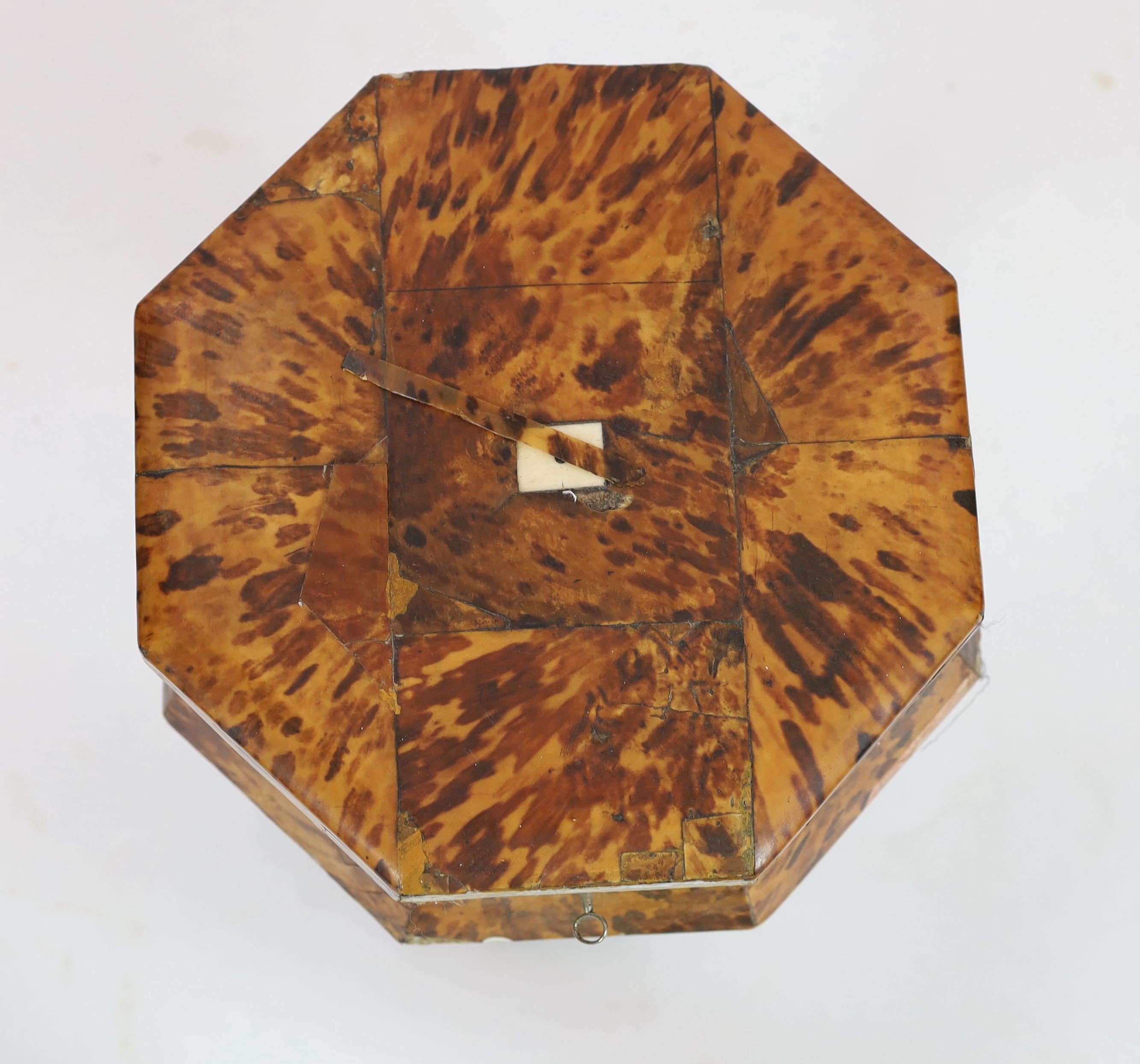 A mid 19th century tortoiseshell veneered pedestal work table, 48cm high 34cm diameter